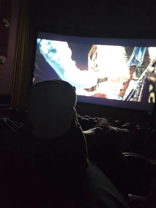 Doug posing in front of the movie